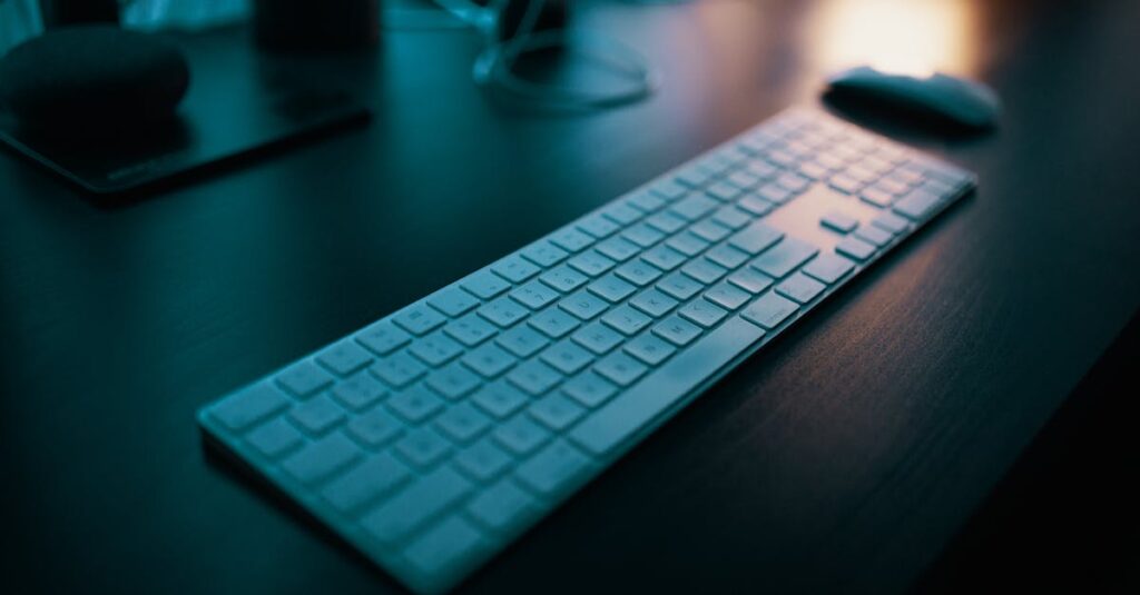 A modern wireless keyboard placed on a sleek desk, illuminated by ambient lighting in a tech-savvy office setting.
